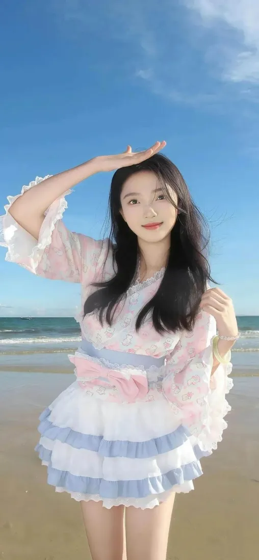 海边美女手机壁纸｜沙滩背景 - 粉蓝裙「哲风壁纸」