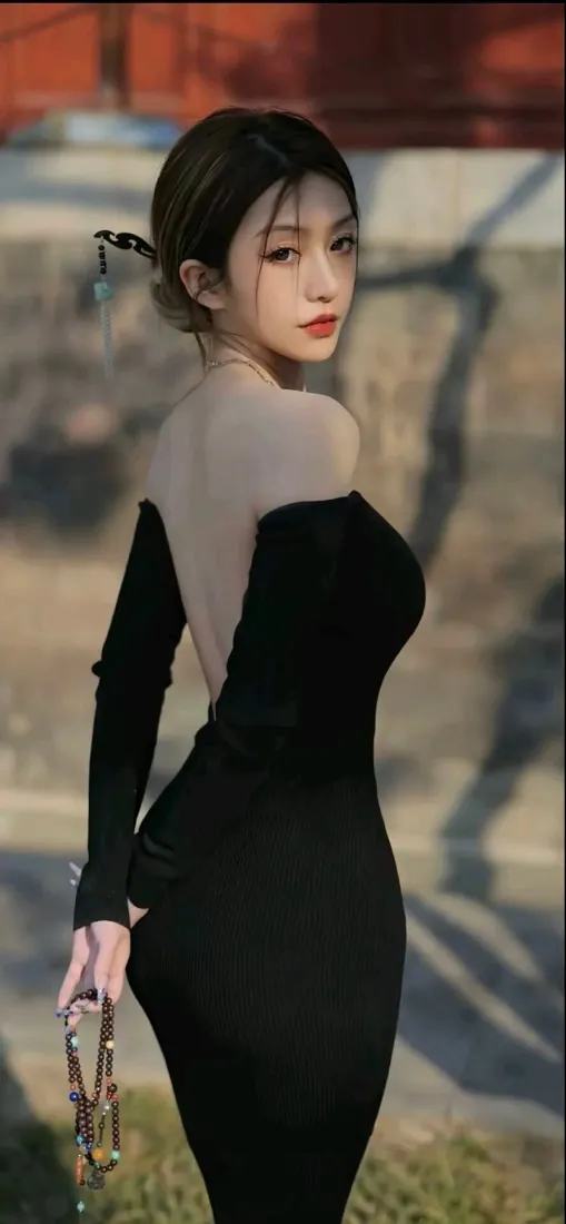 黑衣美女手机壁纸｜红墙背景图片 - 露肩裙「哲风壁纸」