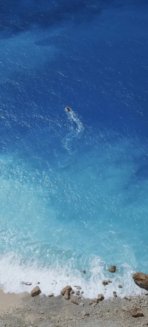 海洋手机壁纸｜蓝色背景图片 - 海水游泳者礁石「哲风壁纸」